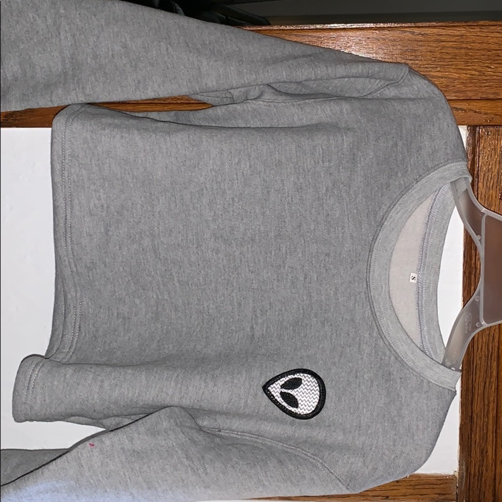 A crop top alien sweater